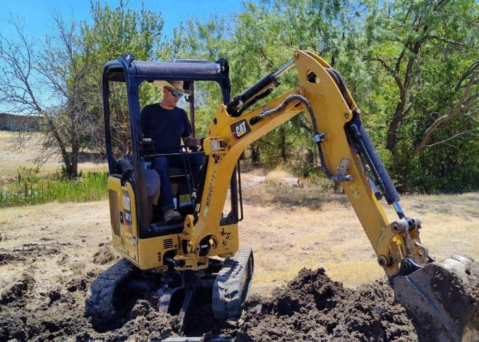 Ross Carter working on the tractor